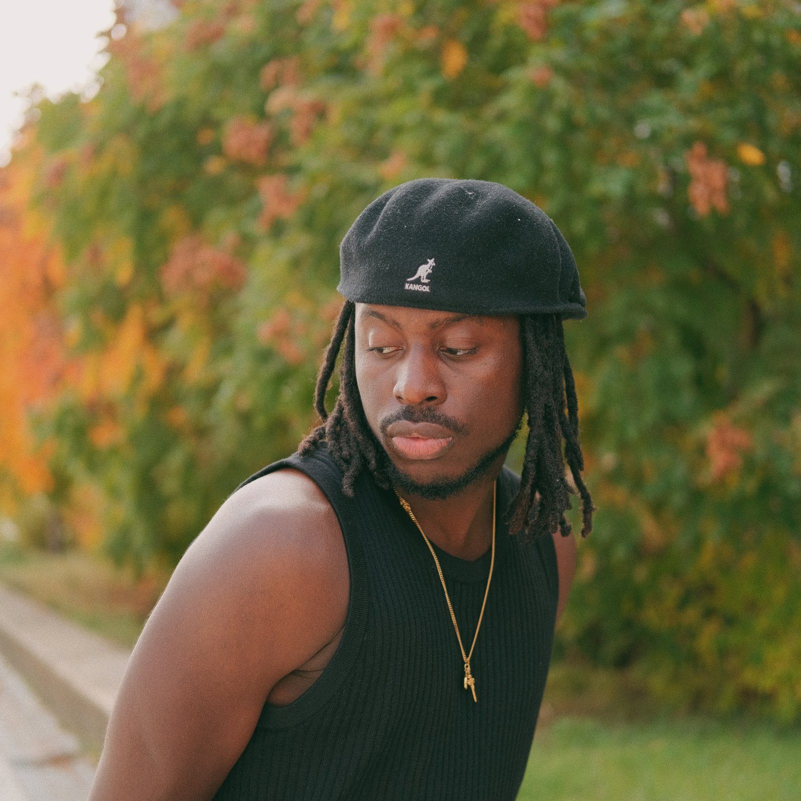TMARO in a black Kangol beret
